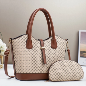Classic printed tote bag set with brown leather handles and matching small pouch