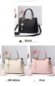 Detail view of large lychee textured tote bags in black, beige, and pink with gold hardware