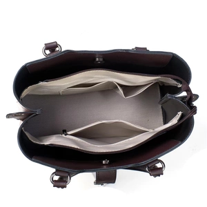 Interior view of the vintage tote showing multiple compartments and gray lining