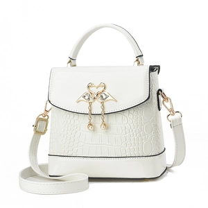 White crocodile pattern tote bag with golden swan buckle and pearl pendants