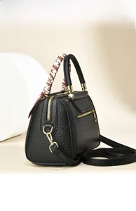 Rear view of black lychee grain tote bag with decorative scarf and gold hardware