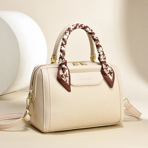 Cream lychee leather tote bag with silk scarf handle and golden hardware detail