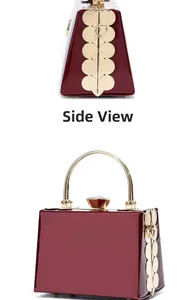 Detail view of burgundy patent leather evening bag with golden floral side petals and handle