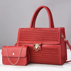 Elegant red leather tote bag and chain crossbody bag set with woven texture and gold locks