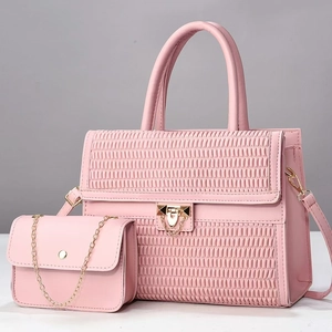Pink tote and chain bag two-piece set featuring woven texture and gold metal hardware