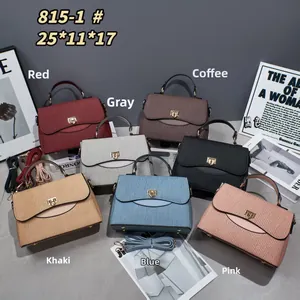 Detail view of wavy embossed leather handbags in seven colors with gold twist locks