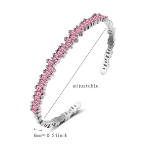 Detailed macro view of adjustable silver bracelet with wavy pink zircon inlay