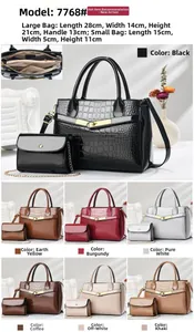 Internal structure detail showing multiple compartments in a stone texture handbag