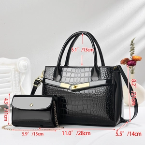 Detail view of black crocodile pattern handbag set with golden twist lock and dimensions