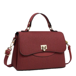 Elegant burgundy striped handbag with gold geometric buckle and removable shoulder strap