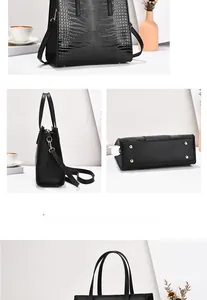 Details der schwarzen Handtasche mit Krokoprägung, Metallnieten und abnehmbarem Gurt
