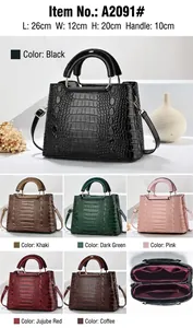 Detail of crocodile embossed shoulder bag with dimensions 26cm x 12cm x 20cm