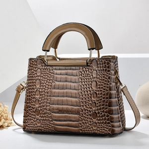 Brown crocodile embossed tote bag with top handle and adjustable shoulder strap