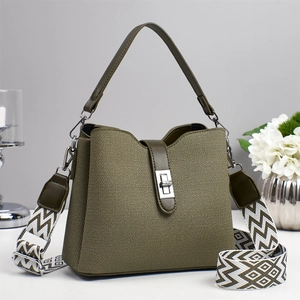 Structured army green bucket bag with striped strap and polished silver turn-lock buckle