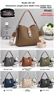 Detailed view of striped bucket bag dimensions 23x11x19cm with woven shoulder strap