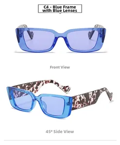 Detail view of rimless metal sunglasses with purple lenses and tortoise temples