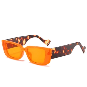 Fashionable rimless square sunglasses with orange lenses and tortoise shell temples