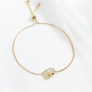 Bracciale regolabile placcato oro con doppi cerchi intrecciati e pavé di micro zirconi