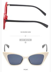 Close-up of small cat eye sunglasses in glossy red and off-white with thick frames