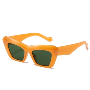 Stylish orange cat eye sunglasses with dark green lenses in a vintage oversized frame design