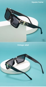 Detail view of black square sunglasses with vintage golden relief on the temple hinge