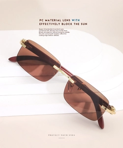 Detail of vintage rimless square sunglasses with wood grain temples and UV protection lenses