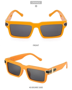 Detail of orange square frame sunglasses featuring gold metal arrow temple accents