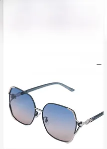 Detail of twisted alloy frame with tiny rhinestones on polarized fashion sunglasses