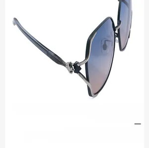Detail of 3D fox head decoration with rhinestones on fashion sunglasses frame