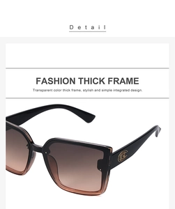 Détail de lunettes de soleil carrées oversize avec monture dégradée et logos dorés