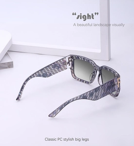 Detail of square sunglasses with purple blue texture and gold F metal hinge detail