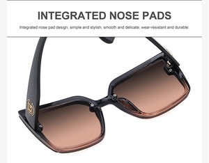 Détail des plaquettes de nez intégrées et du logo doré sur lunettes de soleil noires