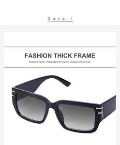 Detail of black thick frame sunglasses with integrated PC frame and golden F-shaped accents