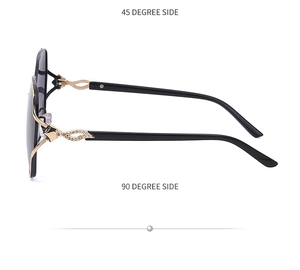 Detail of polarized sunglasses with gold metal temples and sparkling rhinestone fox design