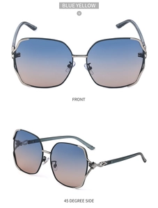 Detail of oversized polarized sunglasses with blue-yellow gradient lenses and rhinestone fox