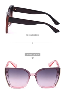 Detail view of purple pink cat-eye sunglasses with gradient lenses and gold metal trim