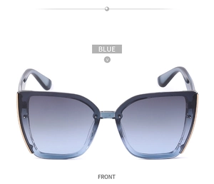 Front view of oversized cat-eye sunglasses with blue gradient lenses and gold accents