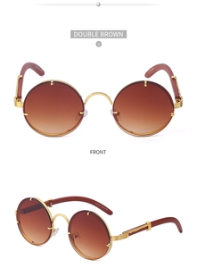Detail view of round rimless sunglasses with brown gradient lenses and wood-textured temples