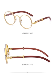 Detail view of round gold metal sunglasses featuring embossed hinges and wood grain temples