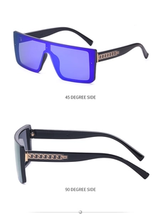 Detail view of large frame sunglasses with black frame and metal chain temple design