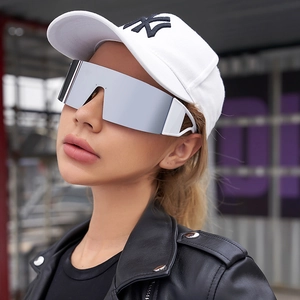 Detail of silver mirrored sports sunglasses with oversized frame and white temples