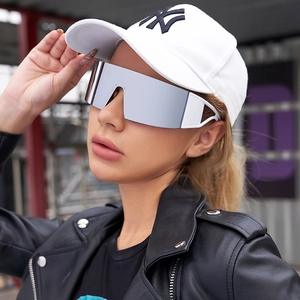 Detail of silver mirrored sports sunglasses with white hollowed temples on a model