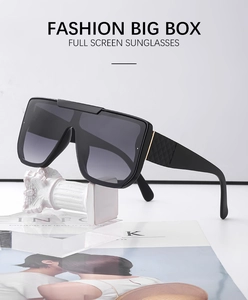 Detail of big box sunglasses featuring textured temples on creative studio display