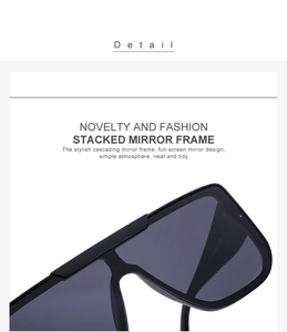 Detail shot of stacked mirror frame design on large oversized black fashion sunglasses