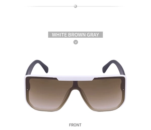 Front view of white shield sunglasses with oversized frames and brown gradient lenses