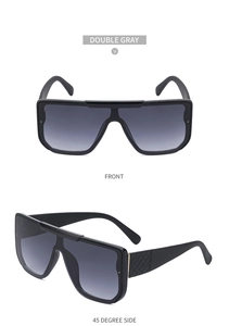 Detail view of oversized sunglasses with double gray gradient lenses and quilted texture
