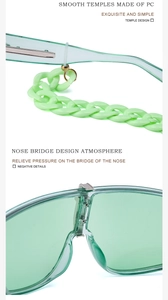 Detail of green semi-transparent sunglasses showing smooth temples and PC chain strap