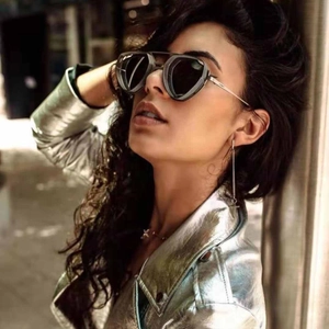 Detail of steampunk metal sunglasses with hollow design and dark polarized lenses