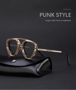 Close-up of steampunk sunglasses with gold metal frame and side mesh hollow design
