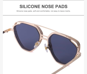 Detail of steampunk sunglasses showing silicone nose pads and textured gold metal frame